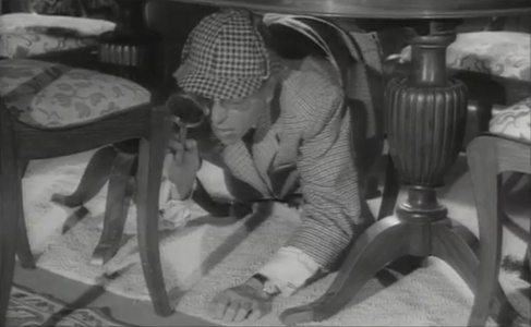Darry Cowl as Félix / Sherlock Holmes.