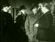 Holmes explains his theory to Lestrade