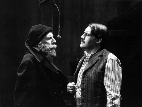 Sherlock Holmes (Paxton Whitehead) and Landlord (John Curless)