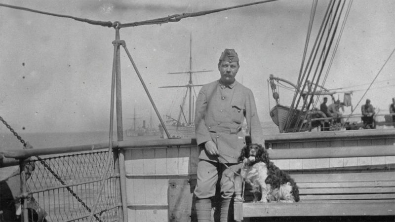 Arthur Conan Doyle on boat with dog.