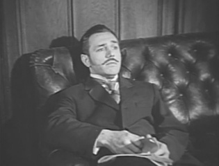 Rowland Bartrop as the Complaining Member in episode The Case of the French Interpreter (1955)