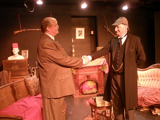 Clifford Gilkey (Dr. Watson) and Jeffrey T. Heyer (Sherlock Holmes) at the close of the Blue Carbuncle in the premiere production of "Holmes For The Holidays" (photo by Cynthia Womack).