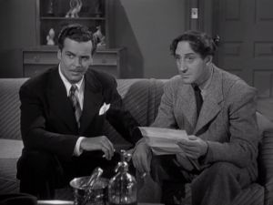 Detective Grogan (left) (Edmund MacDonald)