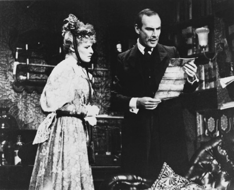 Irene St. Claire (Glenn Close) and Sherlock Holmes (Paxton Whitehead)