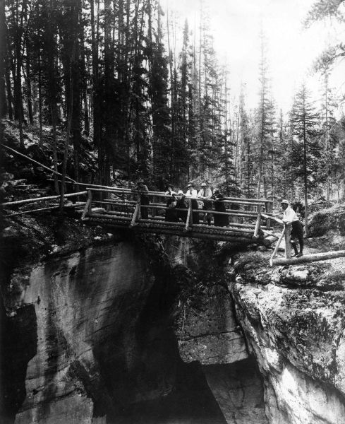 File:1923-arthur-conan-doyle-and-family-on-wooden-bridge-in-alberta-canada.jpg
