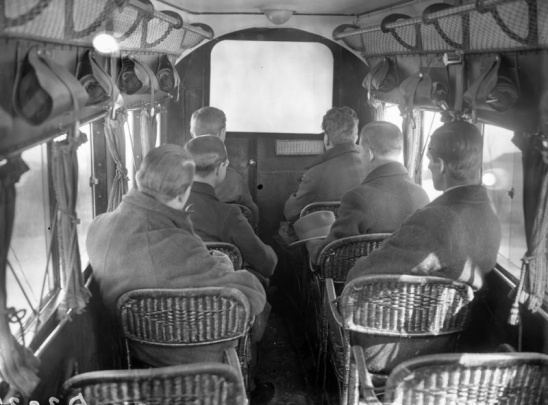 Inside the plane, the saloon with the screen.