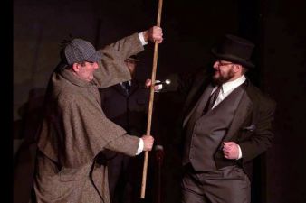 Sherlock Holmes (Jason Steele) and Professor Moriarty (Lee Weselak)