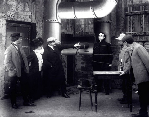 Sherlock Holmes (Einar Zangenberg) tied up in the gas chamber in Det Hemmelige Dokument (1908)