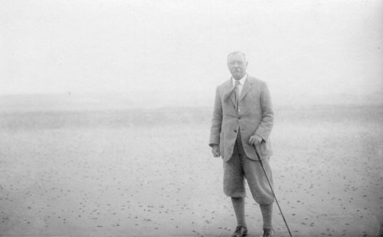 Arthur Conan Doyle walking on a beach (1920s).