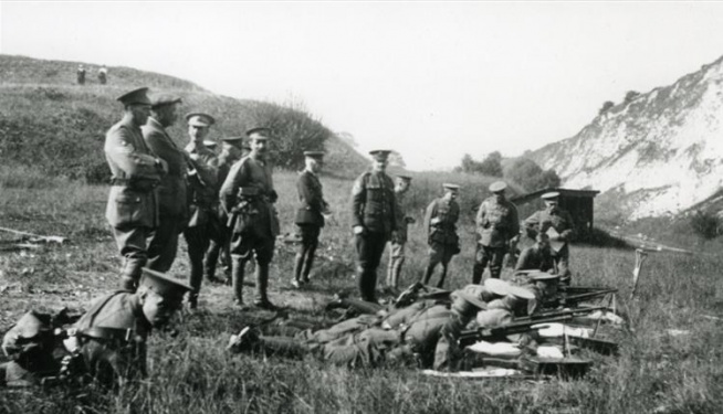 Arthur Conan Doyle (in civilian dress, syanding up second from left) watching riflemen in Lewes (ca. 1914-1918).