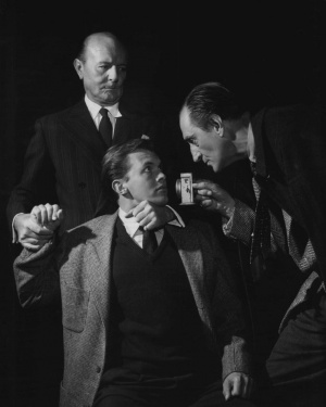 Jack Raine (Dr. Watson), Terence Kilburn (Walker) and Basil Rathbone (Holmes)