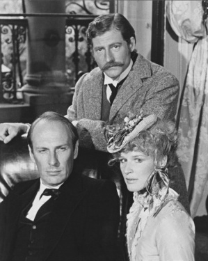 Sherlock Holmes (Paxton Whitehead), Dr. Watson (Timothy Landfield) and Irene St. Claire (Glenn Close)