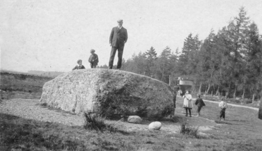 Arthur Conan Doyle standing on the Cumberland stone at the site of the Battle of Culloden (Scotland).