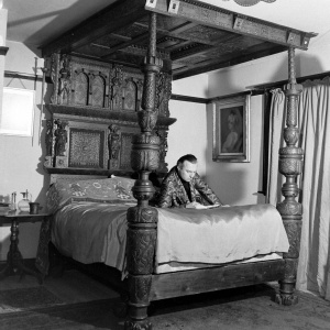 Adrian reading on bed (march 1948).