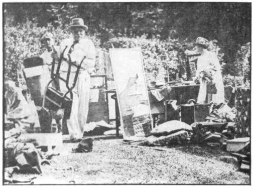 Arthur Conan Doyle, Jean Conan Doyle and Denis Conan Doyle (left) rescuing furniture after their house was burned out (15 august 1929).