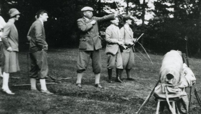 Arthur Conan Doyle doing archery (1920s).