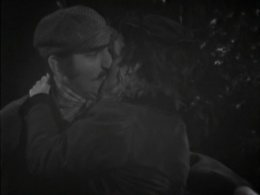 Holmes kissing Agatha