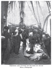 Flensing and cutting up blubber on board.