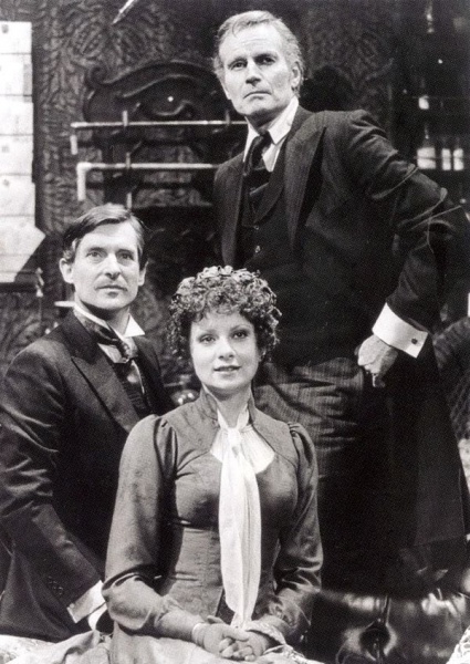Dr. Watson (Jeremy Brett), Sherlock Holmes (Charlton Heston) and Irene St. Claire (Suzanne Lederer)