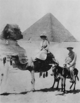 Arthur Conan Doyle and his wife Jean visiting the Pyramids, Cairo, Egypt. Conan Doyle wrote on the back "Everyone happy except the donkey."